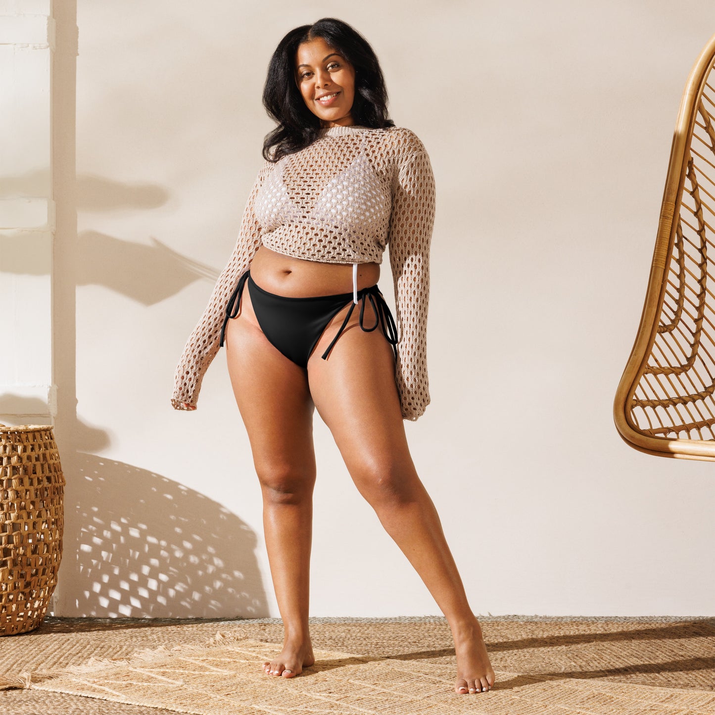 Woman in an aisoi String Bikini Bottom | True Black